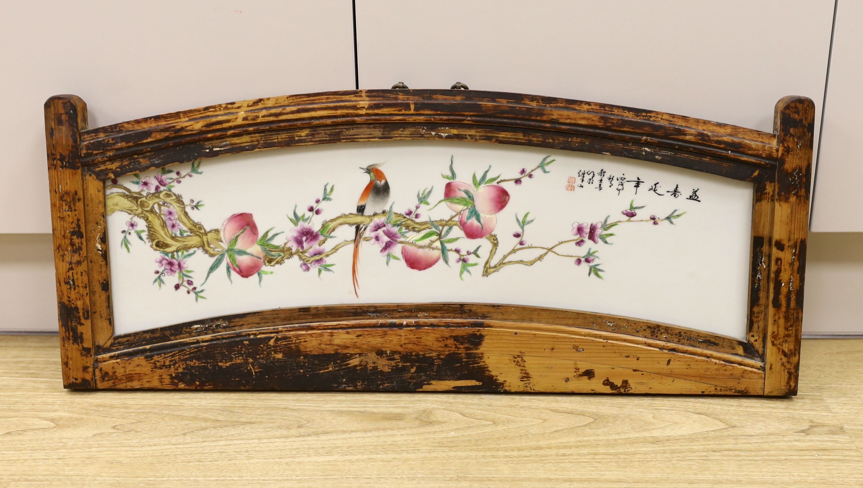 A 20th century Chinese framed porcelain panel, frame 79 cm wide